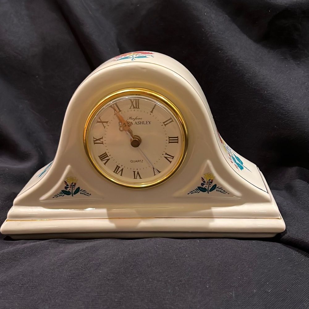 Decorative desk/shelf clock.  Floral detail. Battery operated.  Gold trim.